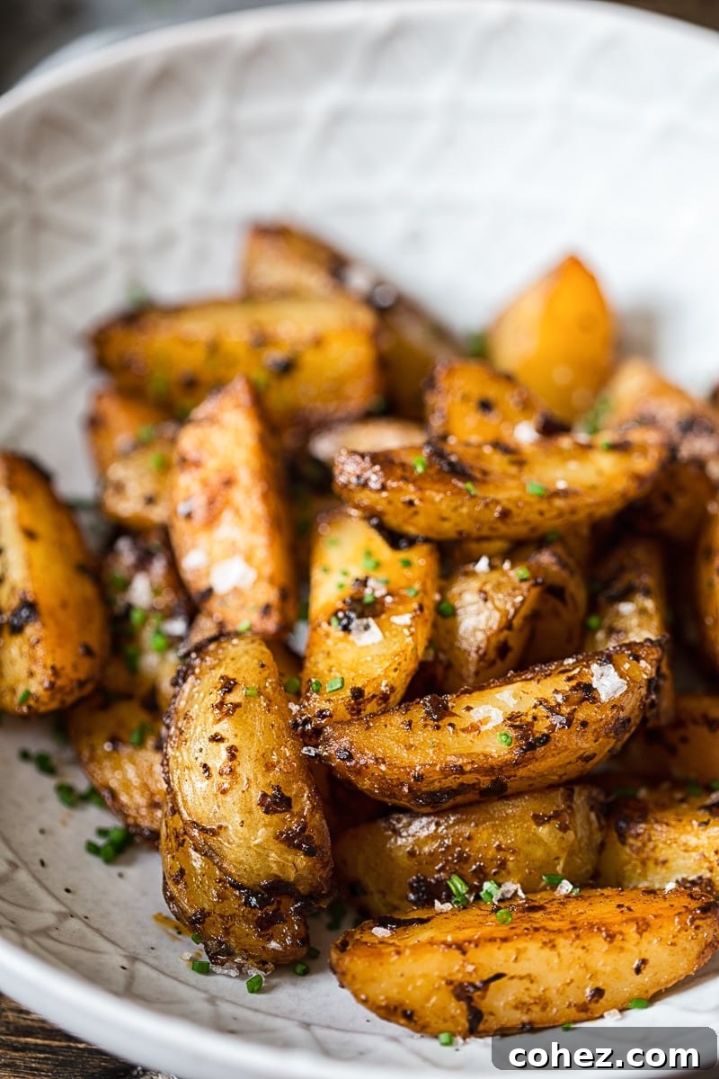 Close-up of perfectly roasted Chipotle Mayo Potato Wedges, showing the vibrant color and crispy texture, ready to be served.