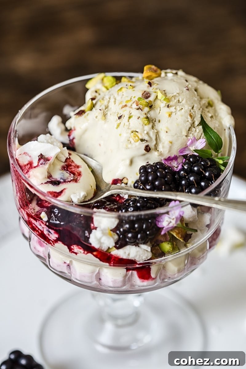 Dish of the Eton mess with a spoon and berries