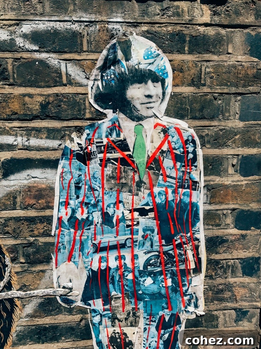 Unveiling Shoreditch's Urban Canvas 7 A person stands observing a large, colourful Shoreditch street art mural on a brick wall, capturing its scale