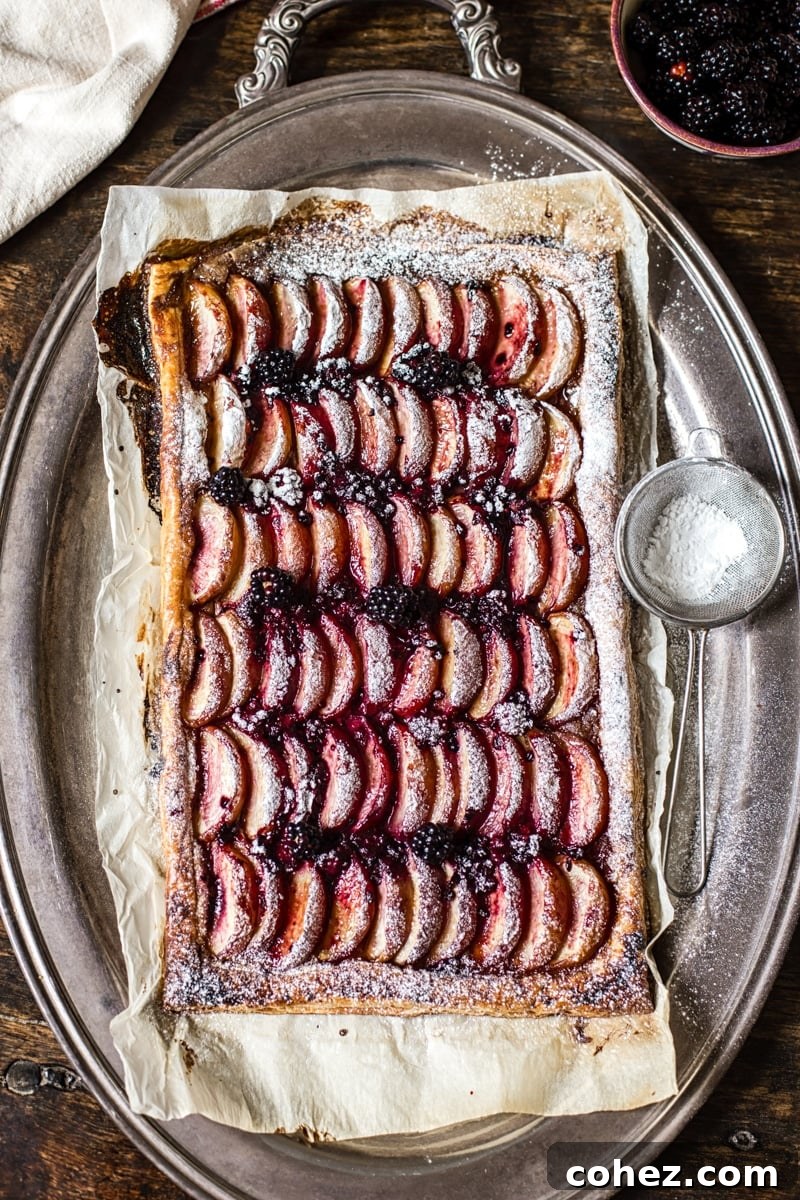 Beautifully presented Peach and Blackberry Tart on a serving platter