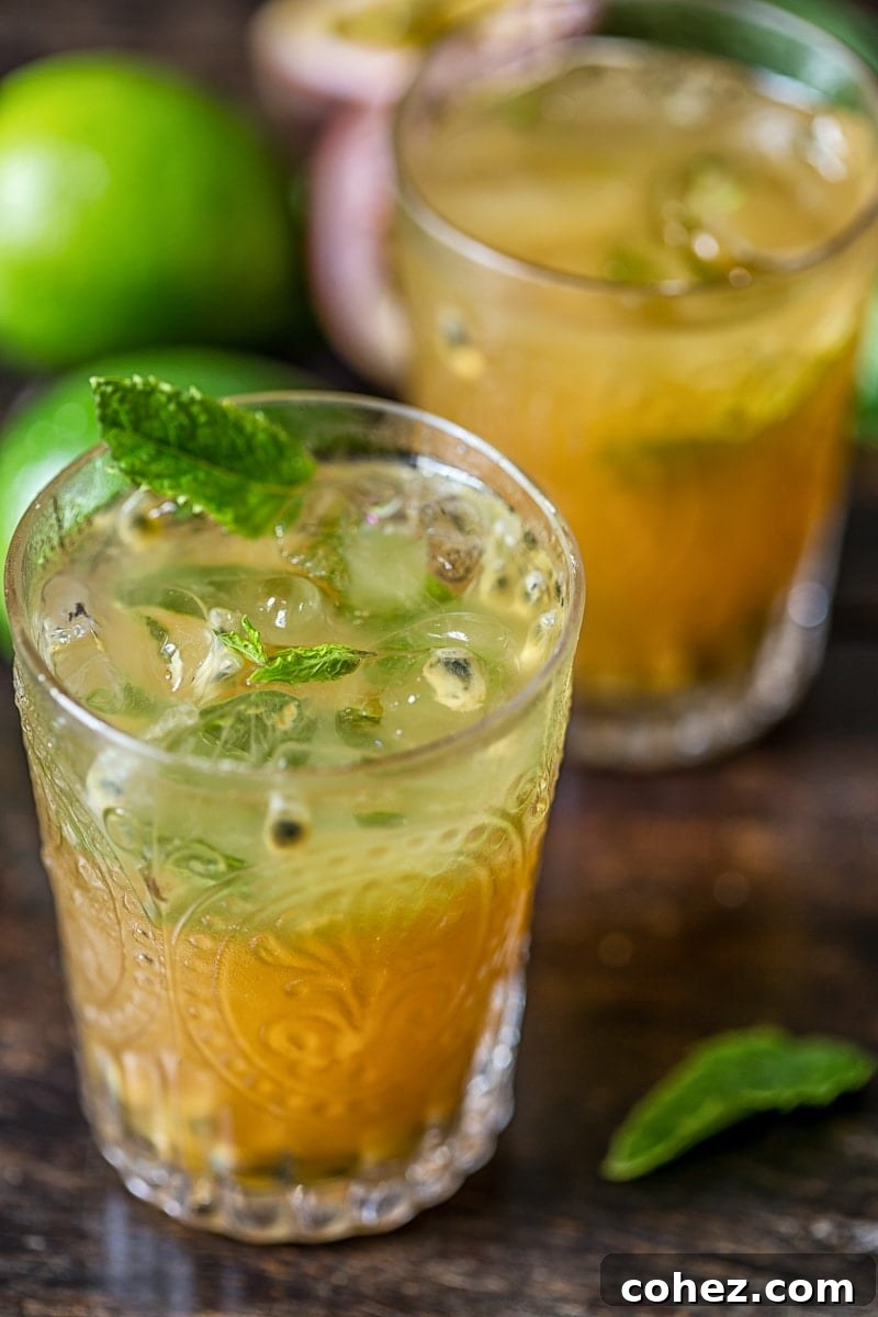 Island Passion Quencher 3 Close-up of a refreshing Passion Fruit Mojito, showcasing the rich color and inviting texture
