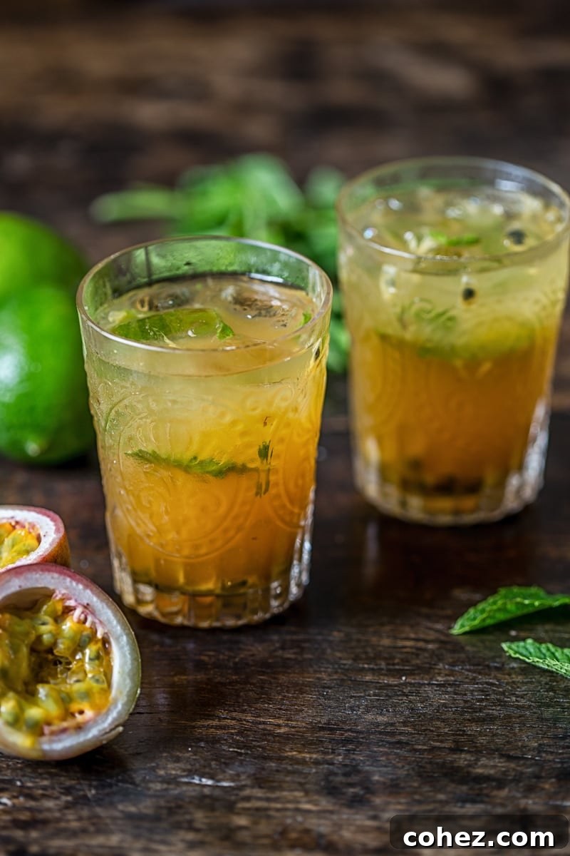 Island Passion Quencher 4 Three glasses of Passion Fruit Mojito, garnished and ready to serve, set on a bright summer background