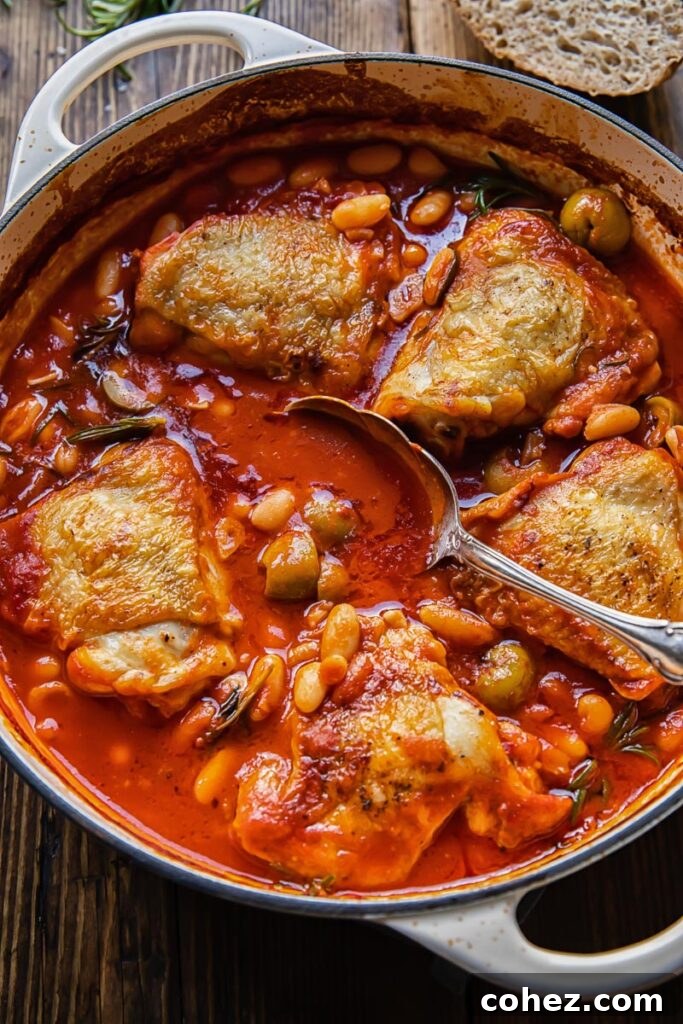 stew in a pan from the top down with a serving spoon