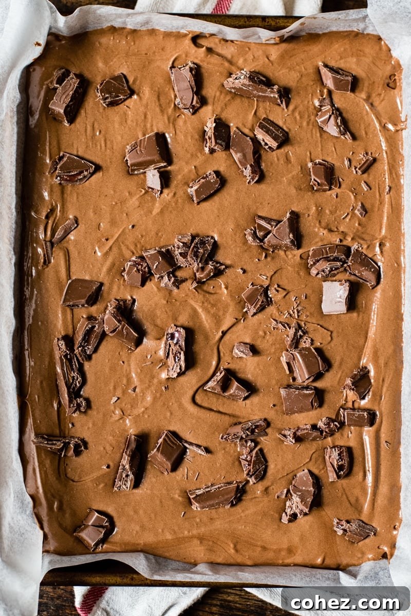 Rosewater Infused Chocolate Brownies 3 A pan of freshly baked brownies with visible chunks of melted chocolate, hinting at their rich flavor