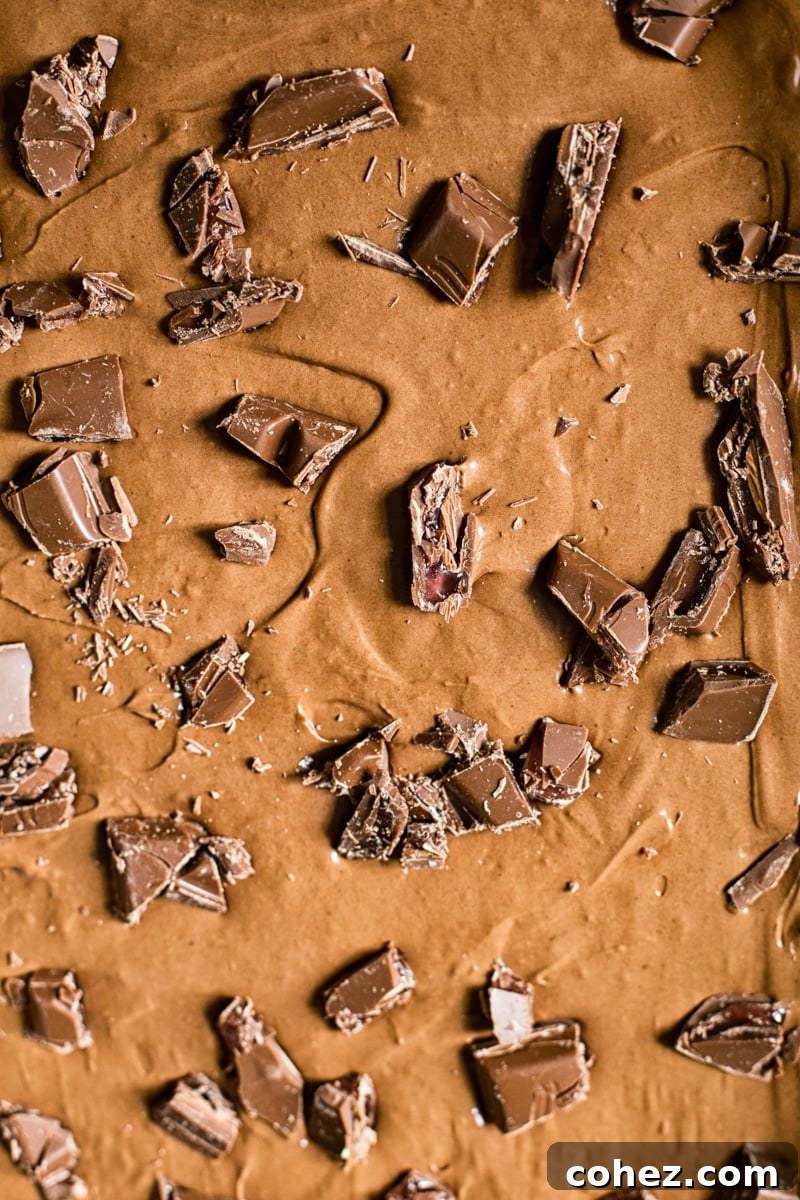 Rosewater Infused Chocolate Brownies 5 A close-up view of the top of a Turkish delight brownie, showing its crinkly surface and scattered chocolate pieces
