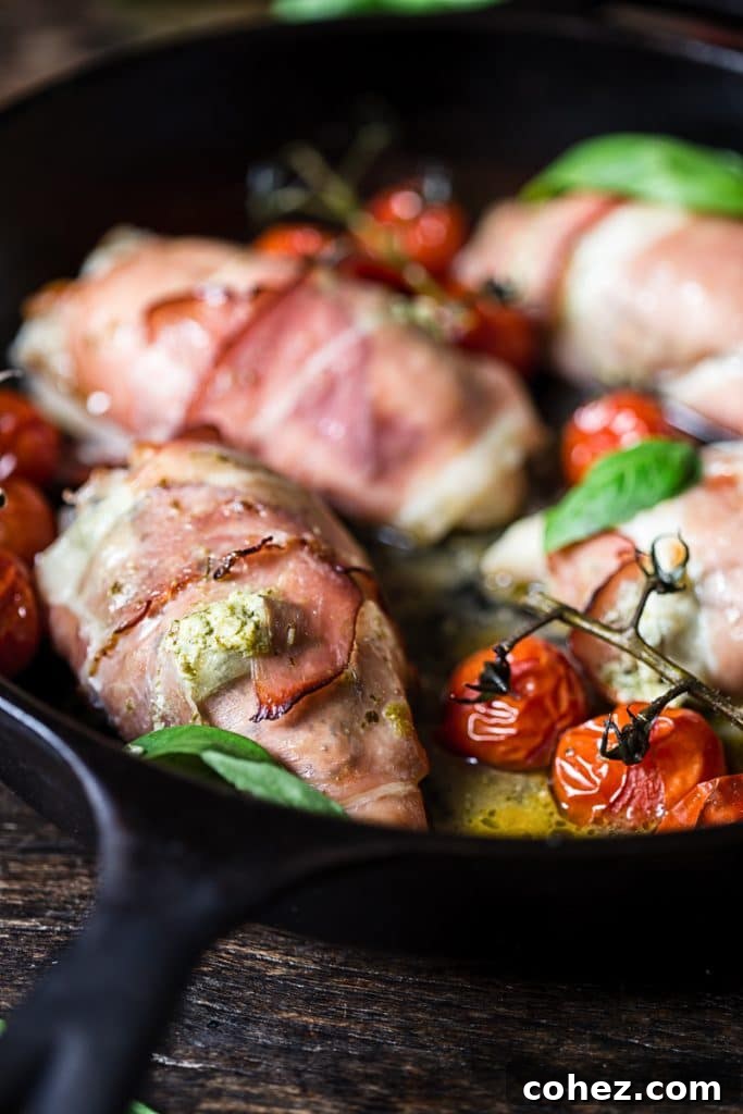 Side view of chicken parcels with cherry tomatoes