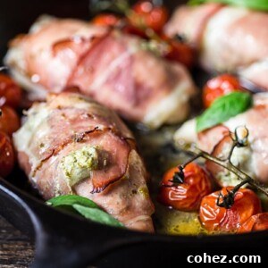 Side view of chicken parcels with cherry tomatoes