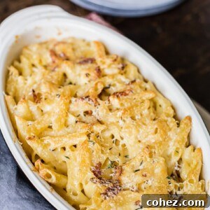 Top down view of a bubbly, golden-crusted Brie and Bacon Macaroni and Cheese, ready to be served from a baking dish.