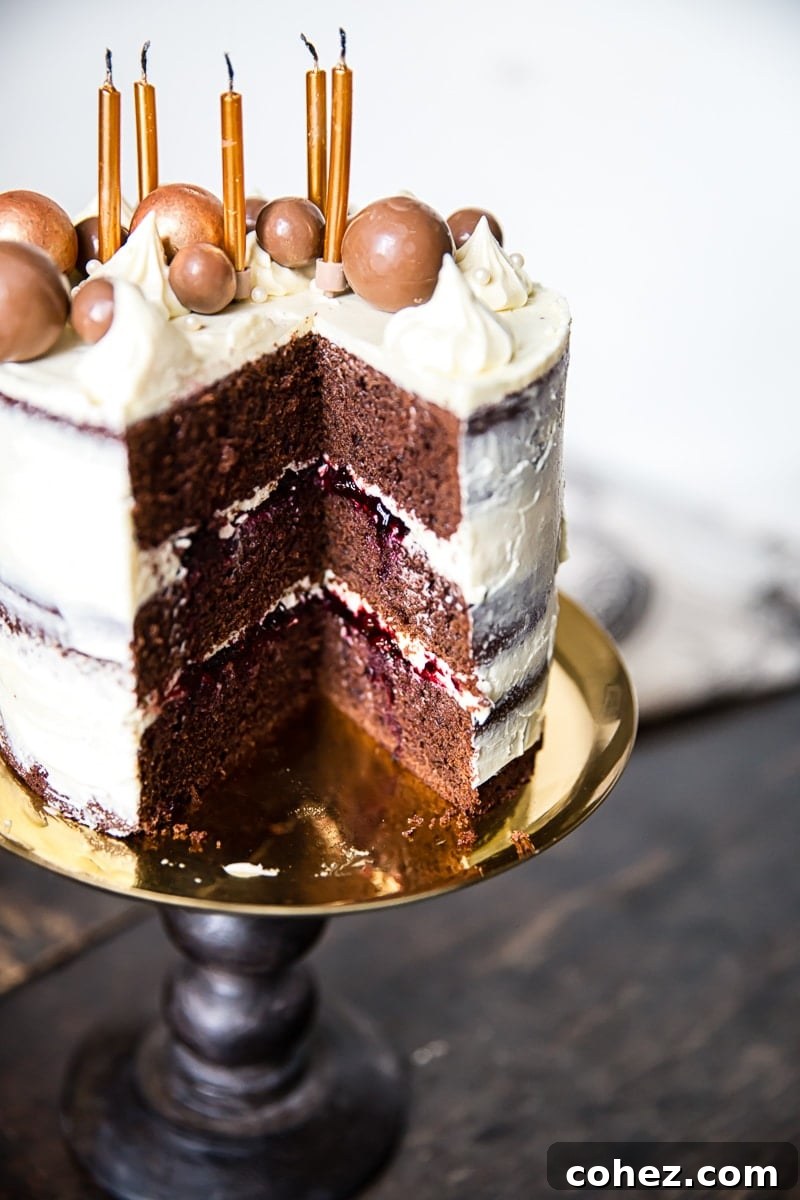 Black and White Chocolate Cake with Blackberry Compote with slice removed