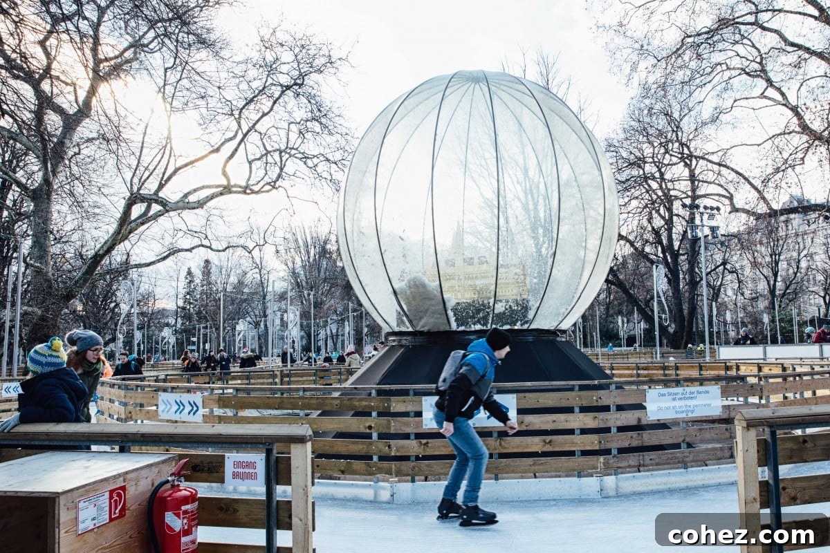 Skater passing a giant snowglobe at the Rathausplatz Christmas Market in Vienna