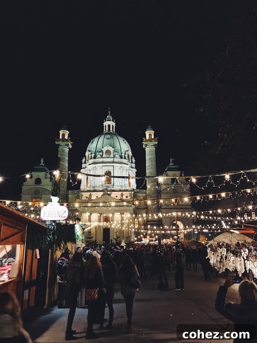 Vibrant Christmas market scene at Karlsplatz, featuring festive lights and bustling stalls