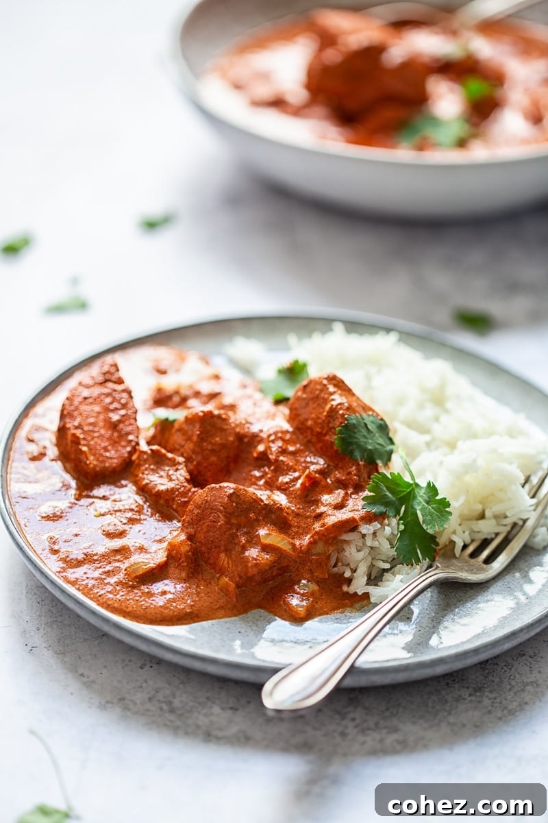 Butter Chicken Curry on a plate with fork