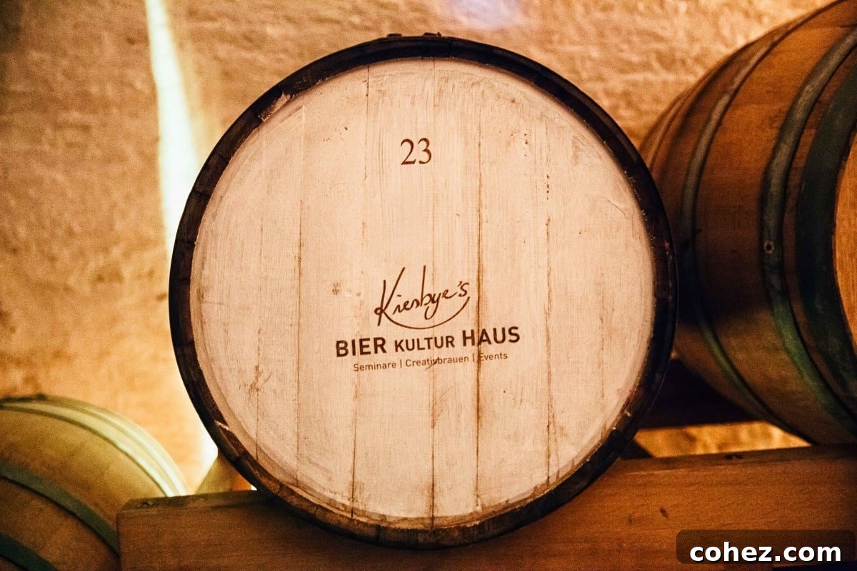 Salzburg's Brews and Baroque Wonders 6 A rustic wooden barrel, likely containing aging beer, from Bierkulturhaus, symbolizing traditional craftsmanship and brewing heritage.