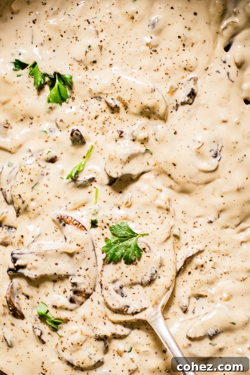 Close up of mushrooms and parsley in cognac sauce