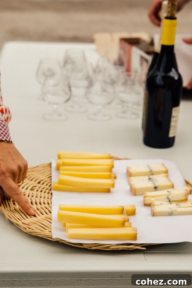 A master cheesemaker carefully inspecting a newly formed wheel of Comte cheese in a traditional French fruitière, ensuring quality.