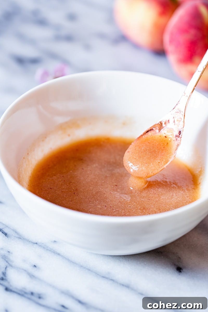 Bowl and spoon with elderflower peach puree
