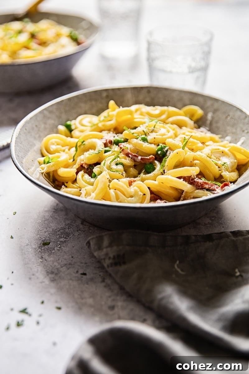 Bowl of pasta with glasses and a towel