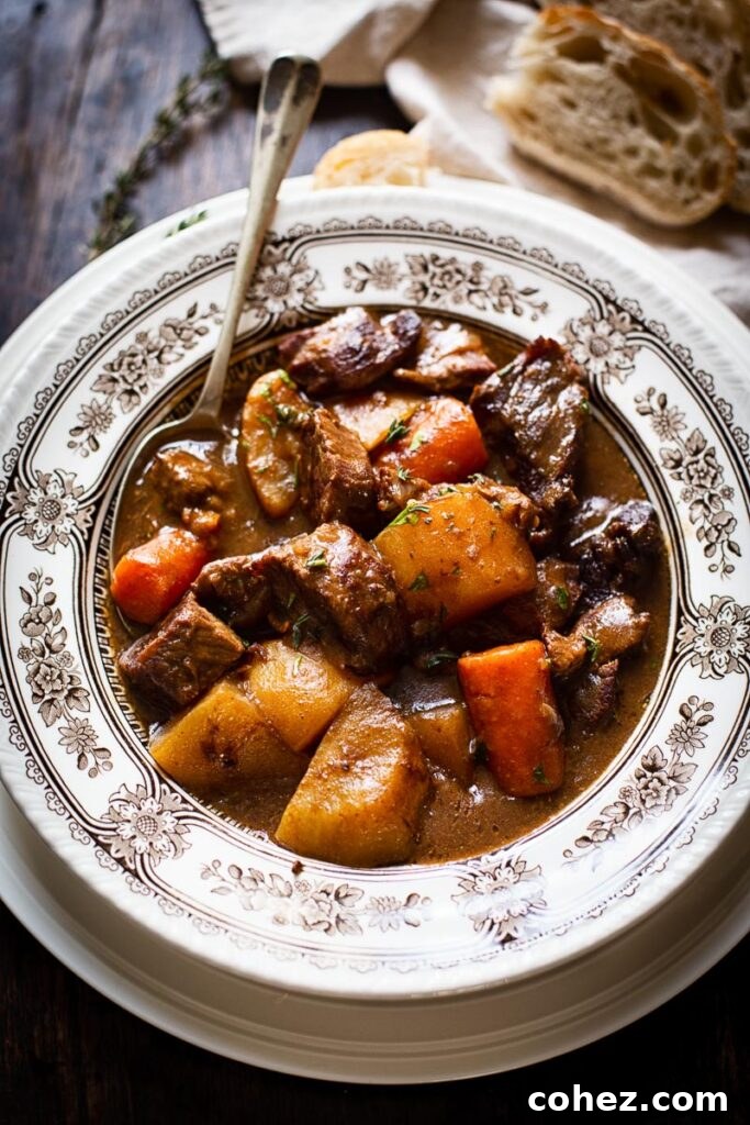A hearty bowl of Irish Beef Stew, garnished with fresh herbs, ready to be enjoyed.
