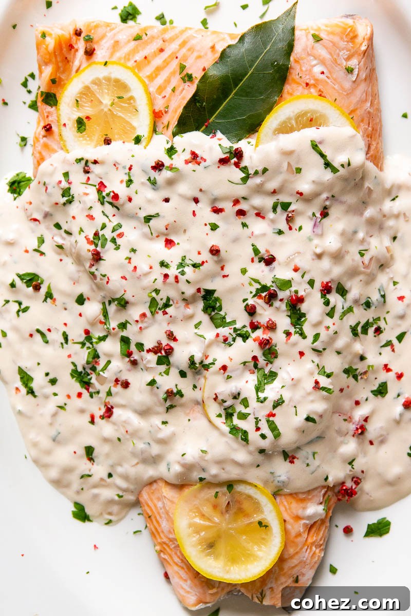 A perfectly cooked piece of salmon generously covered in the luxurious rosé cream sauce.