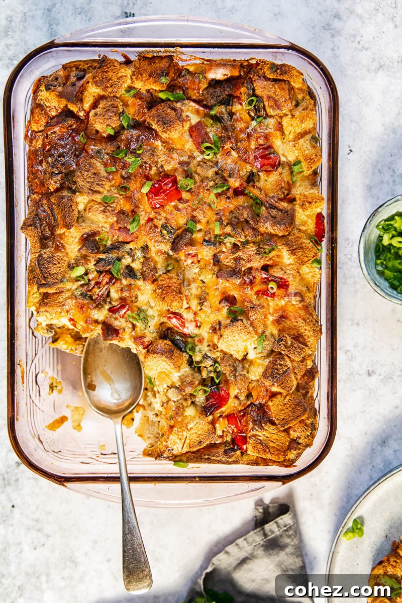 Morning-Ready Sausage and Chorizo Egg Bake 5 Top down view of the entire breakfast casserole in a rectangular baking dish, freshly baked and glistening, with a golden-brown crust, ready to be served.