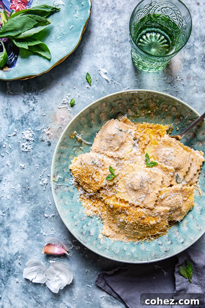Close-up of ravioli with sauce and fresh herbs, ready to serve