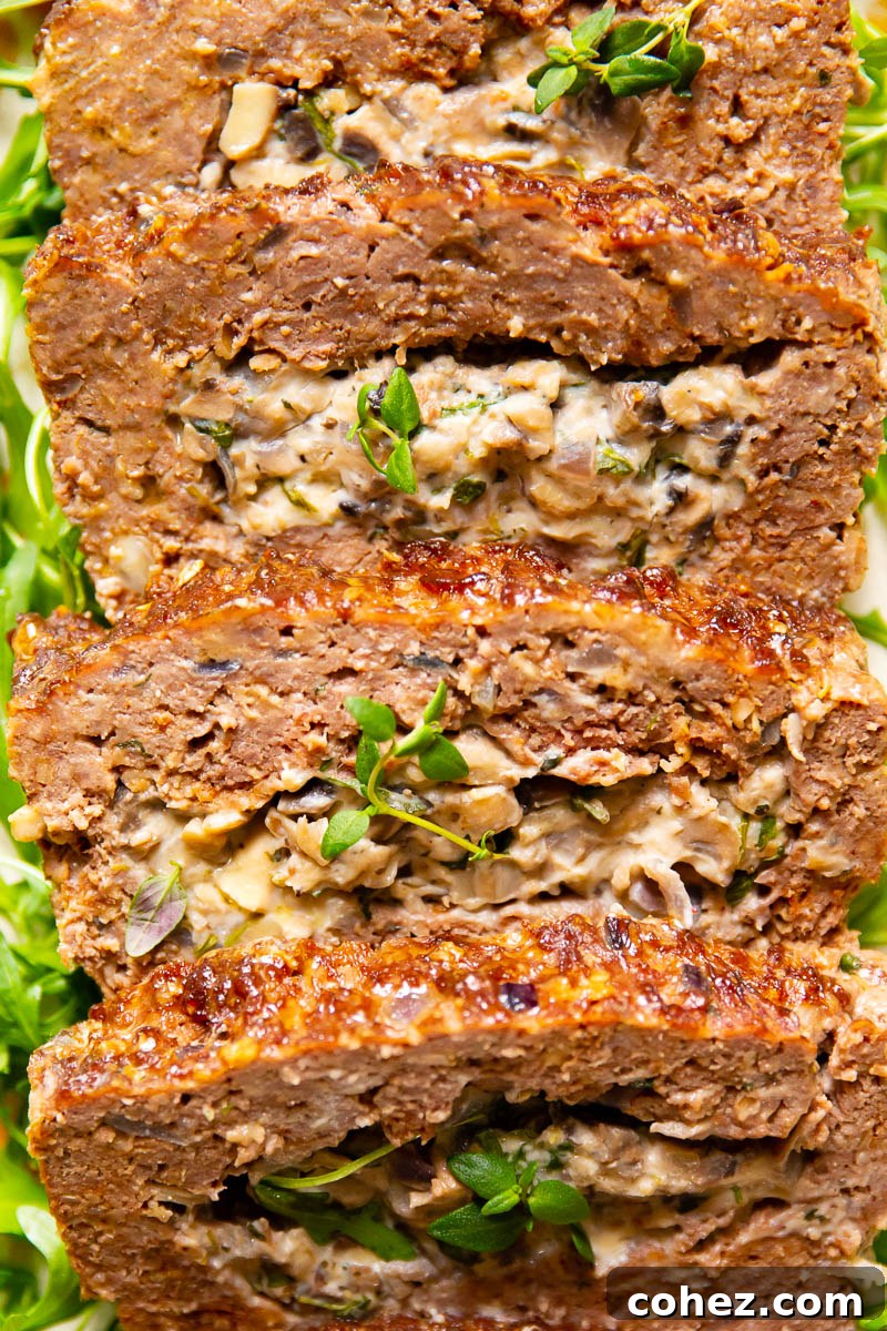 Delicious and moist meatloaf stuffed with creamy mushrooms, herbs, and garlic.