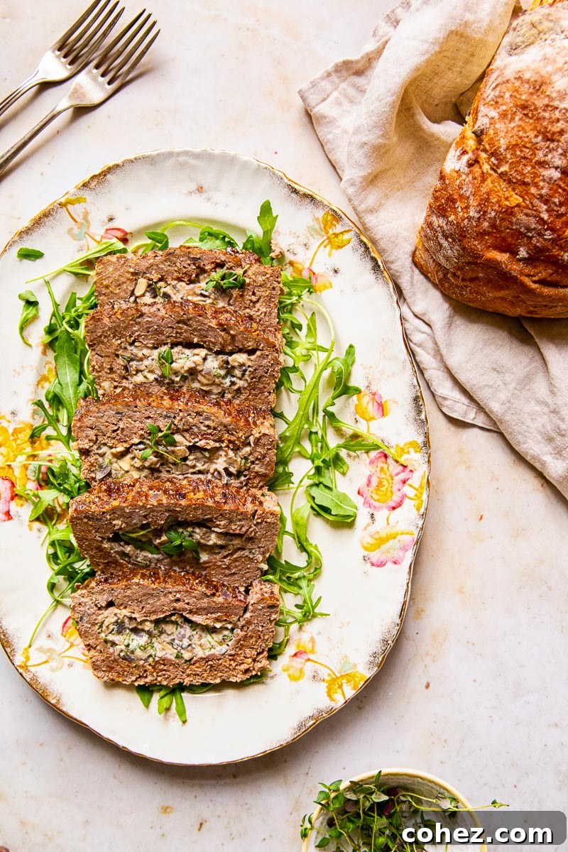 Meatloaf brimming with a rich, herby, and garlicky creamed mushroom filling.