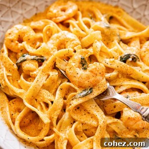 Prawn pasta in creamy tomato sauce in brown bowl
