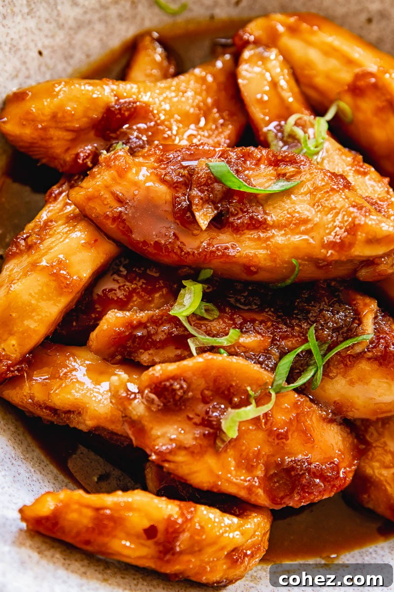 shoyu chicken sprinkled with sliced green onions