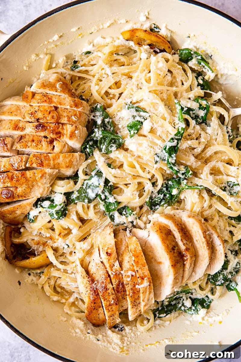 Pasta with spinach and lemon sliced butter chicken breast