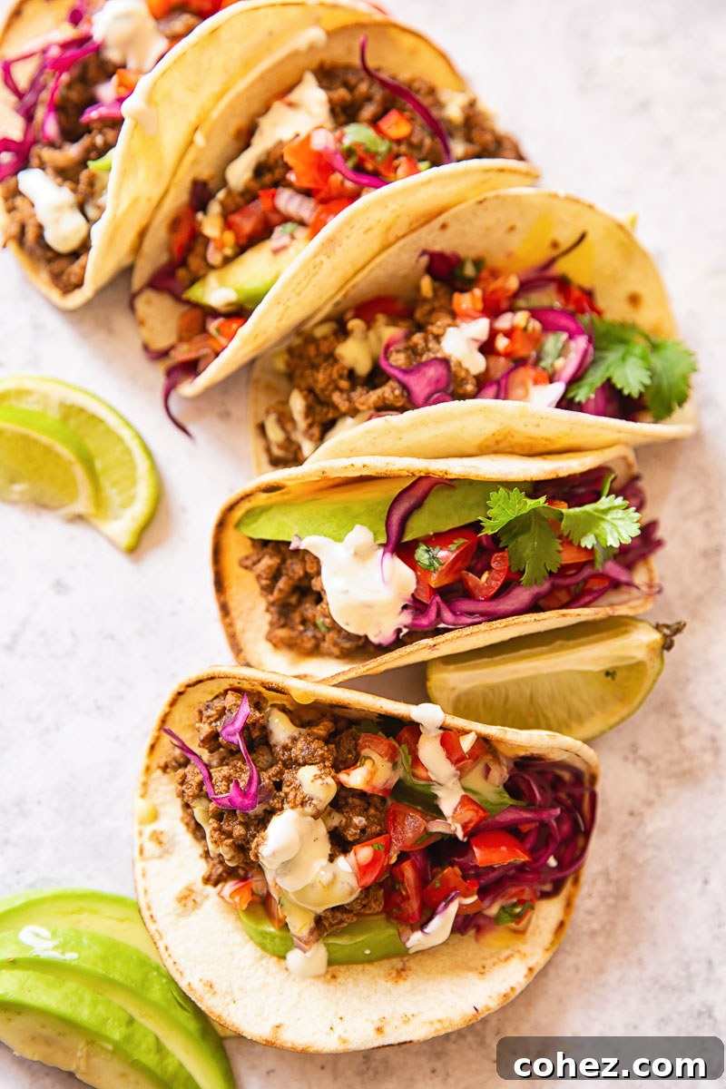 Ultimate Ground Beef Tacos with a Custom Spice Blend 6 Beef Tacos topped with pico de gallo and slaw