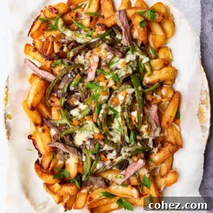 Smothered Philly Cheesesteak Fries 6 Fries loaded with steak, green peppers and melted cheese.