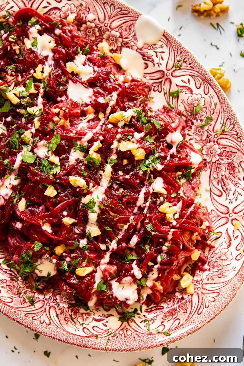 Vibrant Beet and Walnut Salad with Garlic Mayo 2 Beets drizzled with creamy garlic mayonnaise dressing, garnished with fresh herbs and walnuts