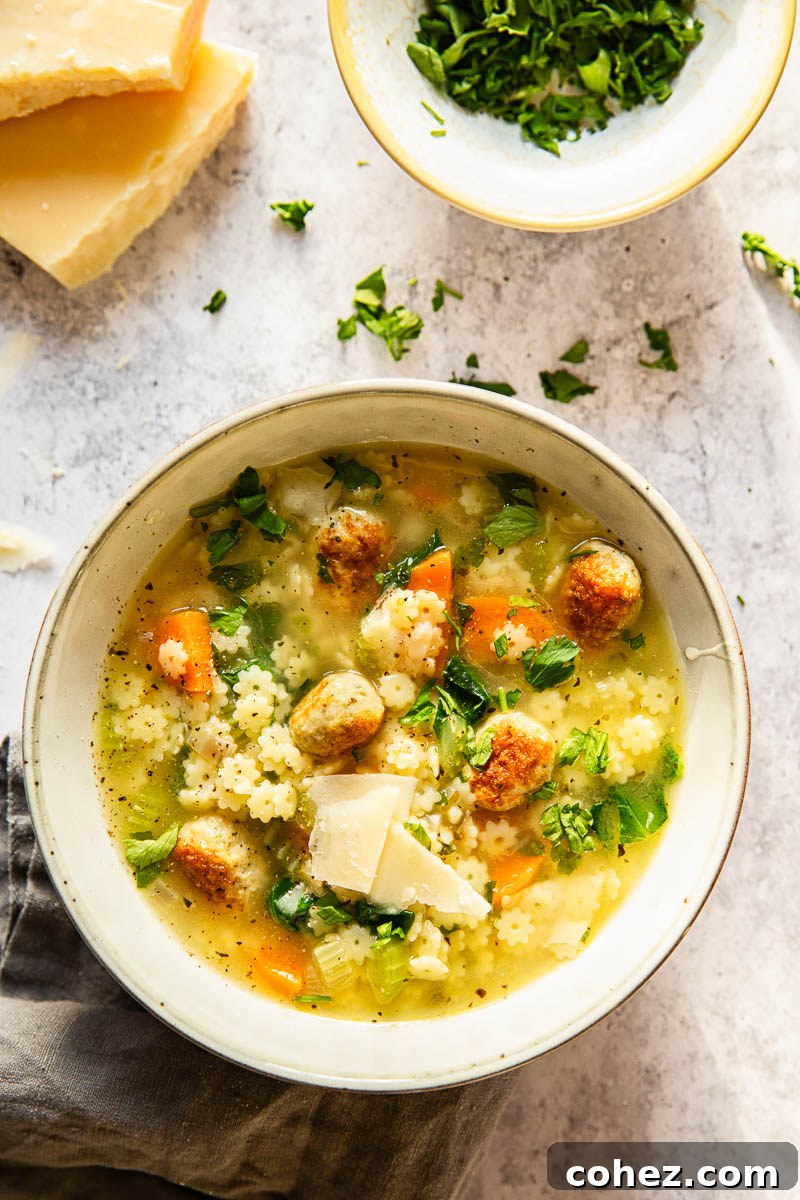 Authentic Italian Wedding Soup 6 Italian Wedding Soup with chopped parsley and shved Parmesan