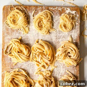 Homemade tagliatelle and tagliolini on wooden board