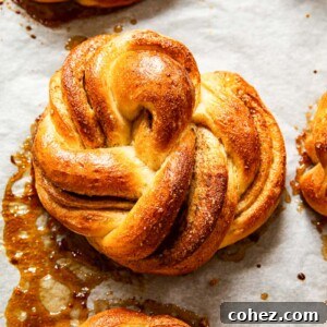 Freshly baked cinnamon rolls cooling on a wire rack