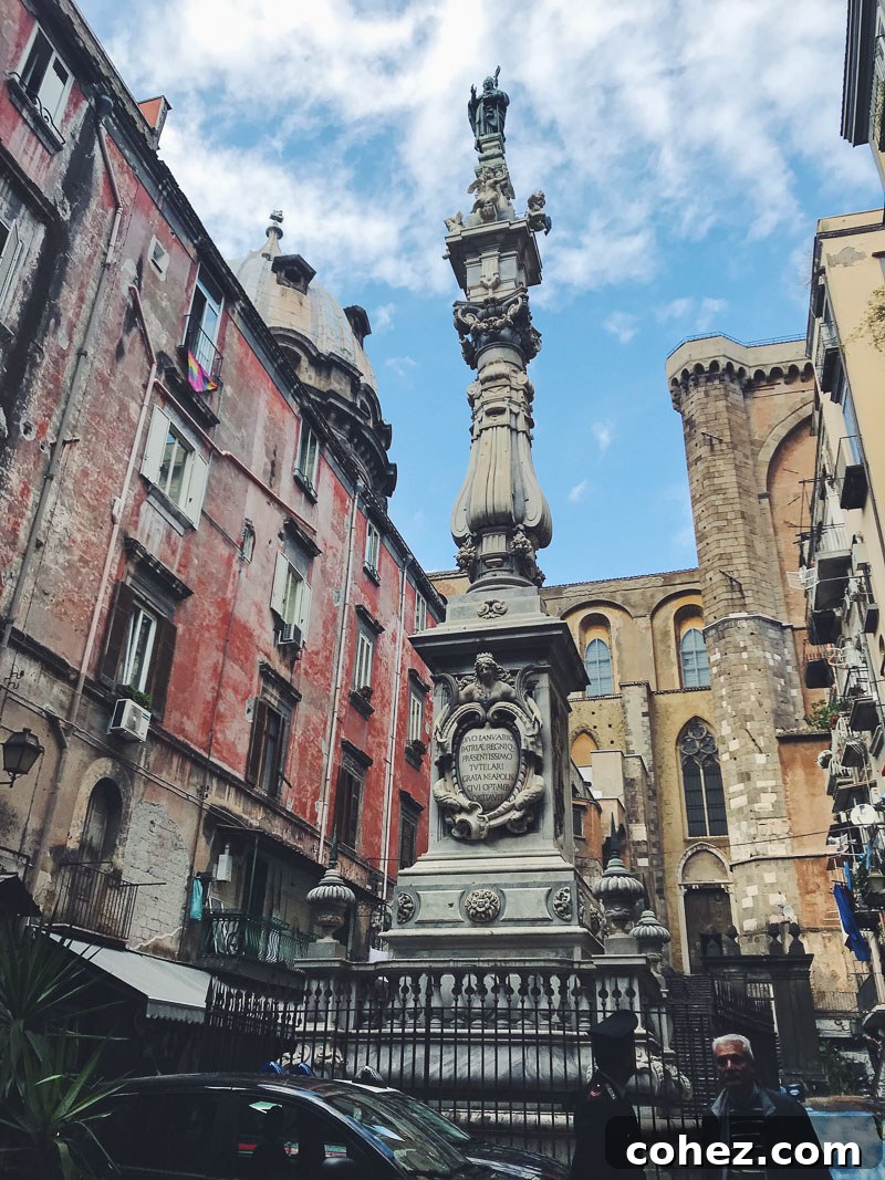 A lively town square in Naples, Italy, bustling with people and historic buildings