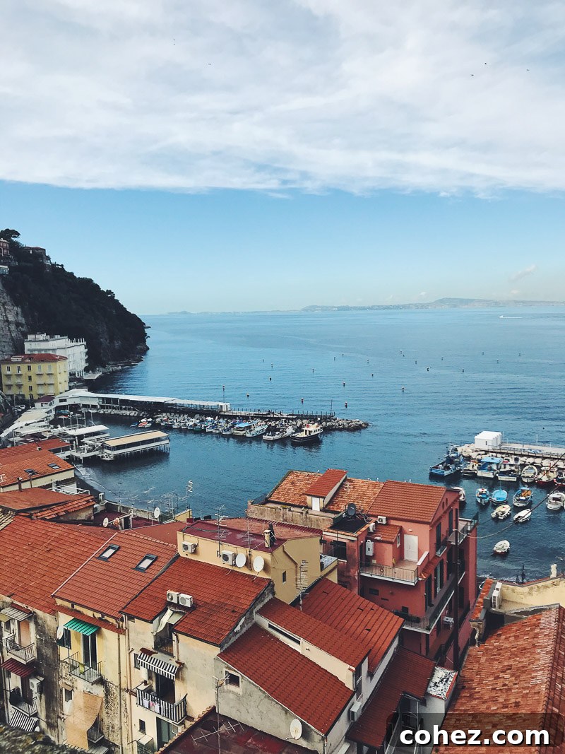 Picturesque view of Sorrento, Italy, with colorful buildings cascading down to the sea