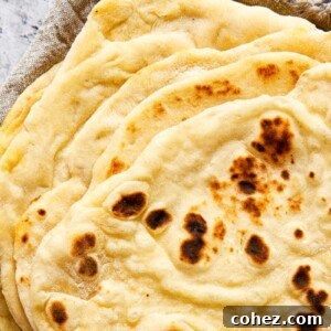 stacked flatbread on grey cloth napkin
