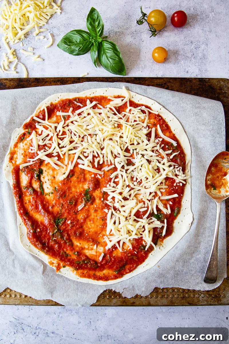 Flaky Puff Pastry Margherita Pizza 3 the process of making puff pastry pizza on a cutting board