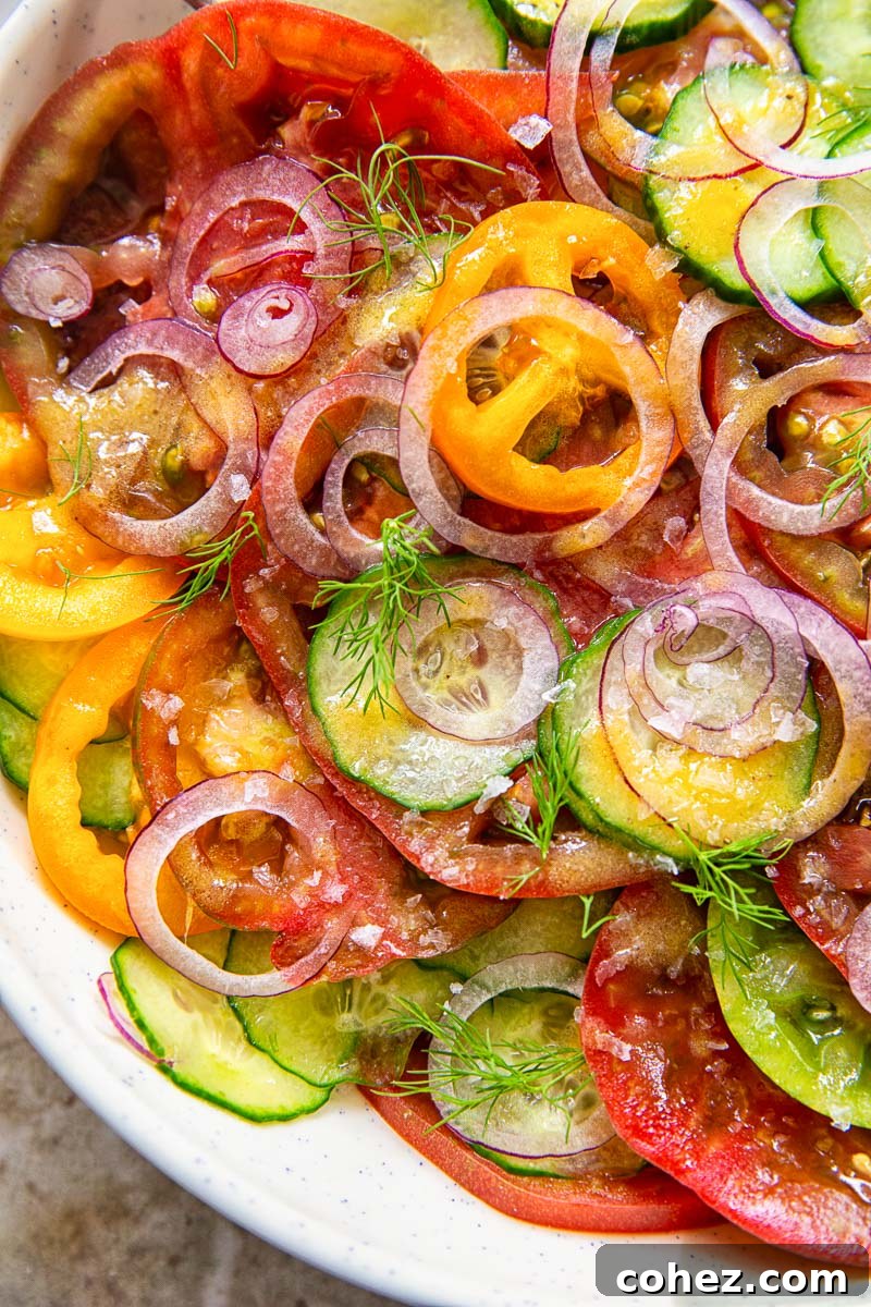 Detailed close-up shot of the cucumber and tomato salad, emphasizing the texture and freshness of each ingredient