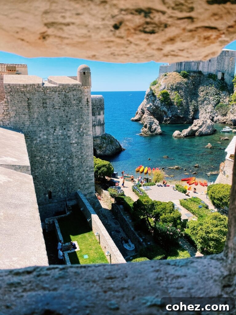 View of a beach framed by a stone window