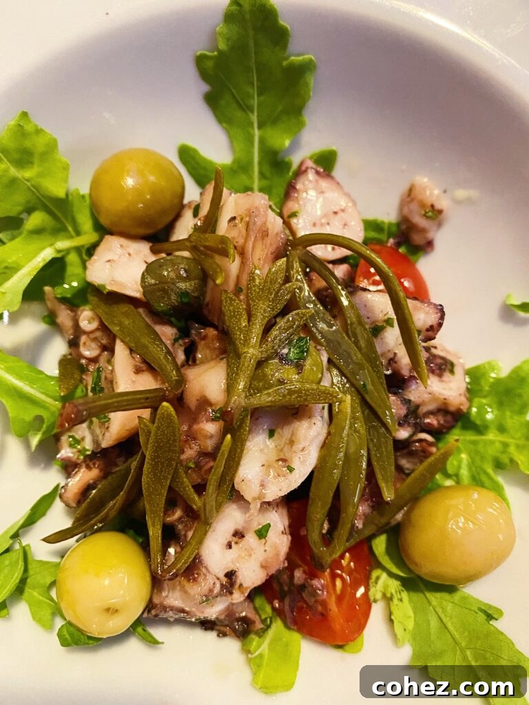 Salad with greens, olives and octopus
