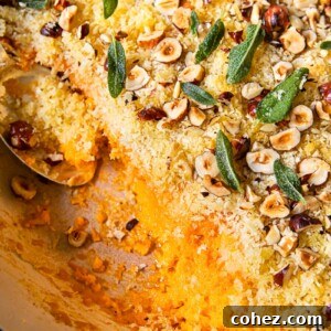 top down view of sweet potato casserole with breadcrumbs, hazelnuts and sage leaves