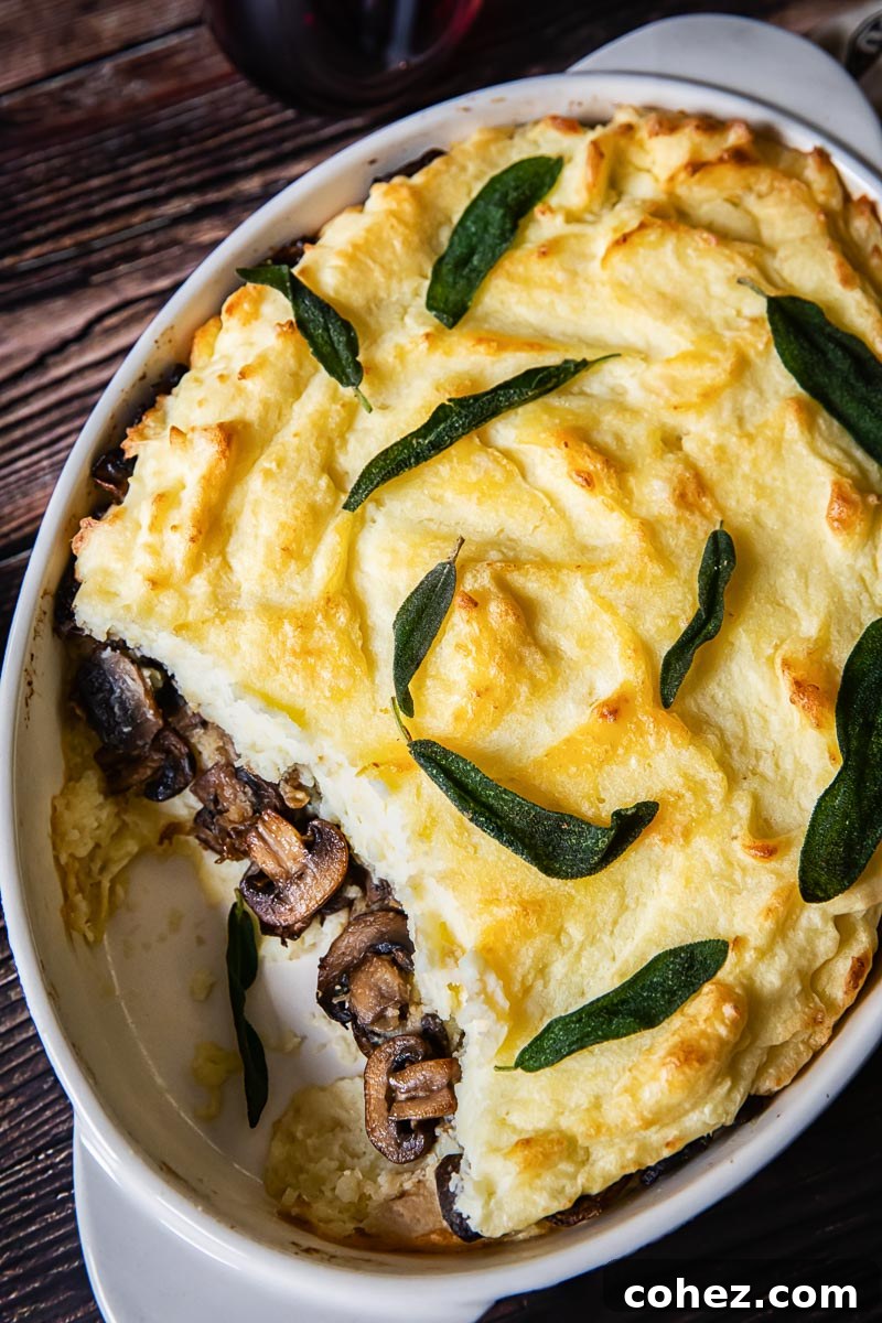 Mashed Potato Casserole with Mushrooms showing in the middle layer, highlighting the layers