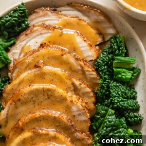sliced pork loin roast covered with gravy