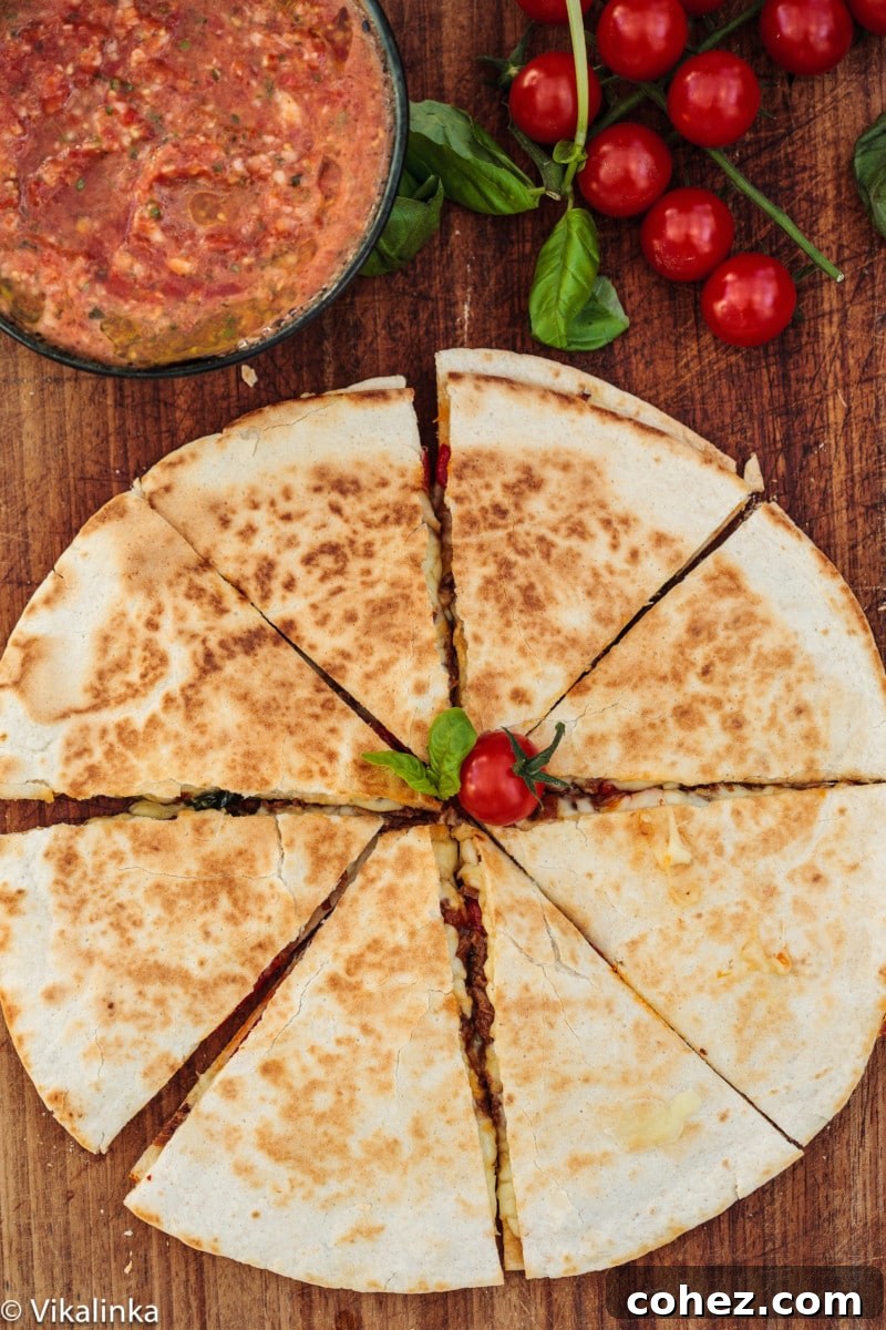 Zesty Italian Beef and Sweet Roasted Red Pepper Quesadilla 2 Top down view of a delicious Italian Beef and Roasted Red Pepper Quesadilla with a side of vibrant homemade salsa
