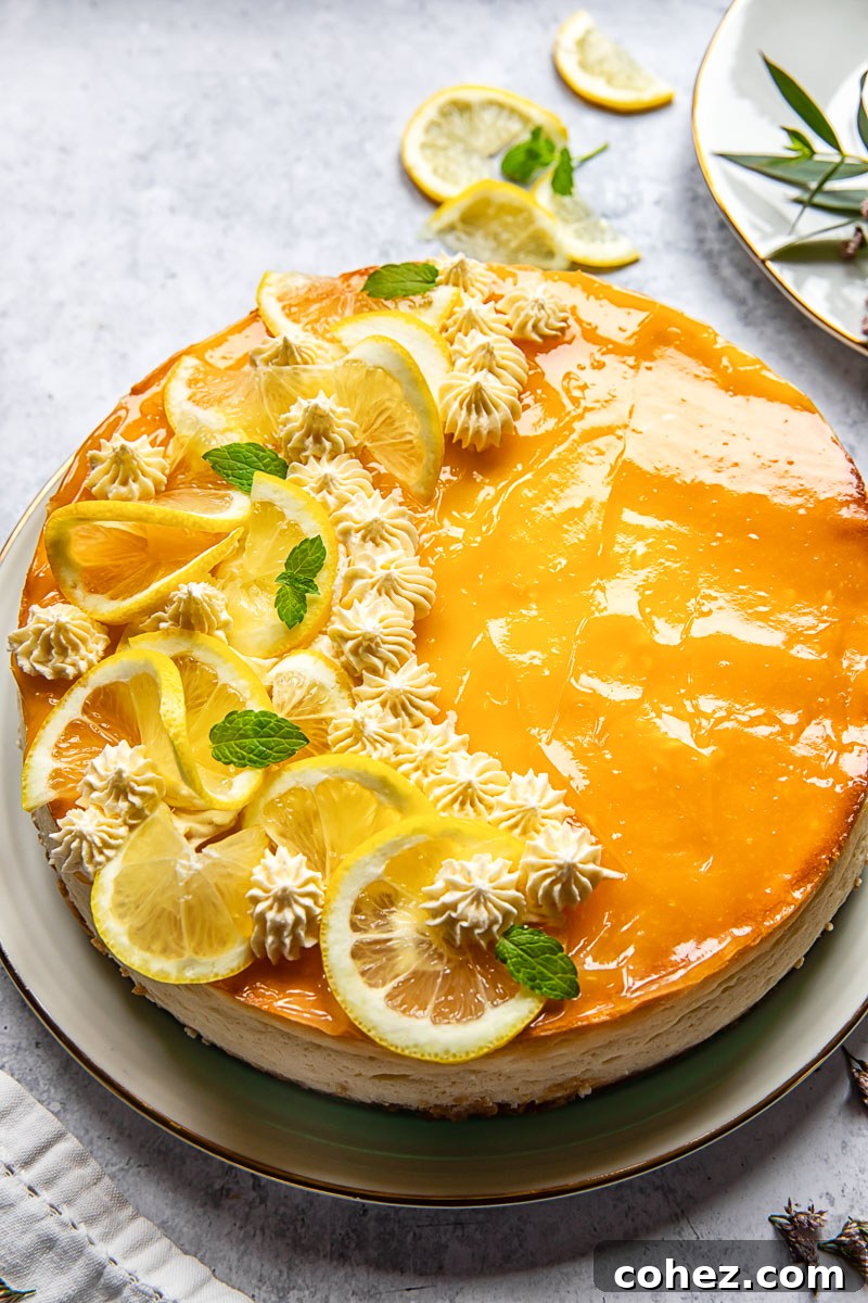 Close-up of a stunning lemon cheesecake decorated with fresh lemon slices and elegant whipped cream rosettes, promising a luxurious dessert experience.