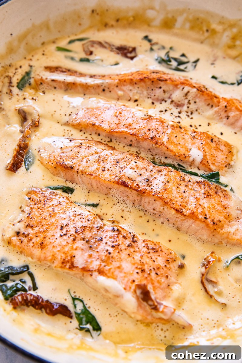 Tuscan Salmon with Velvety Parmesan Cream 2 Pan seared salmon with Parmesan cream sauce flavoured by sun-dried tomatoes, garlic and spinach.