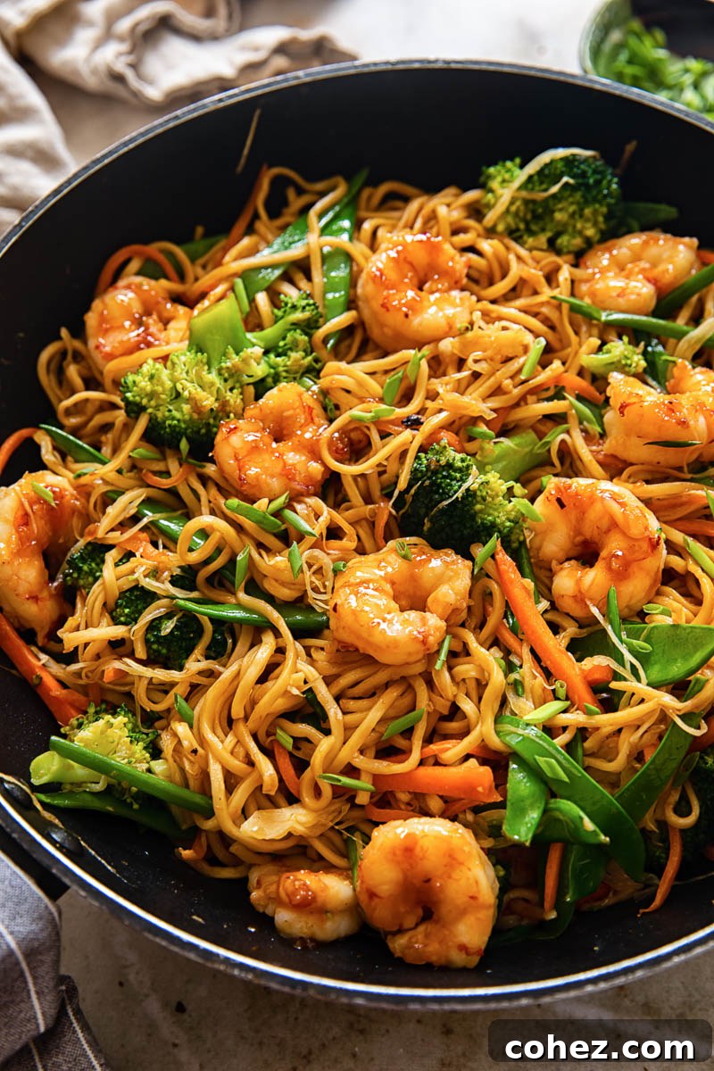 Effortless Shrimp Chow Mein 2 Top down view of shrimp chow mein with stir-fried noodles and crisp vegetables